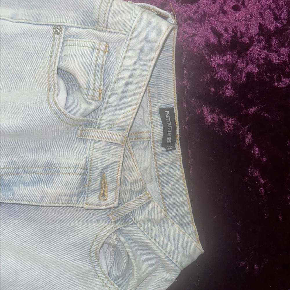 Pretty Little Thing Light Wash Crossover Waist Flare Jeans with Split